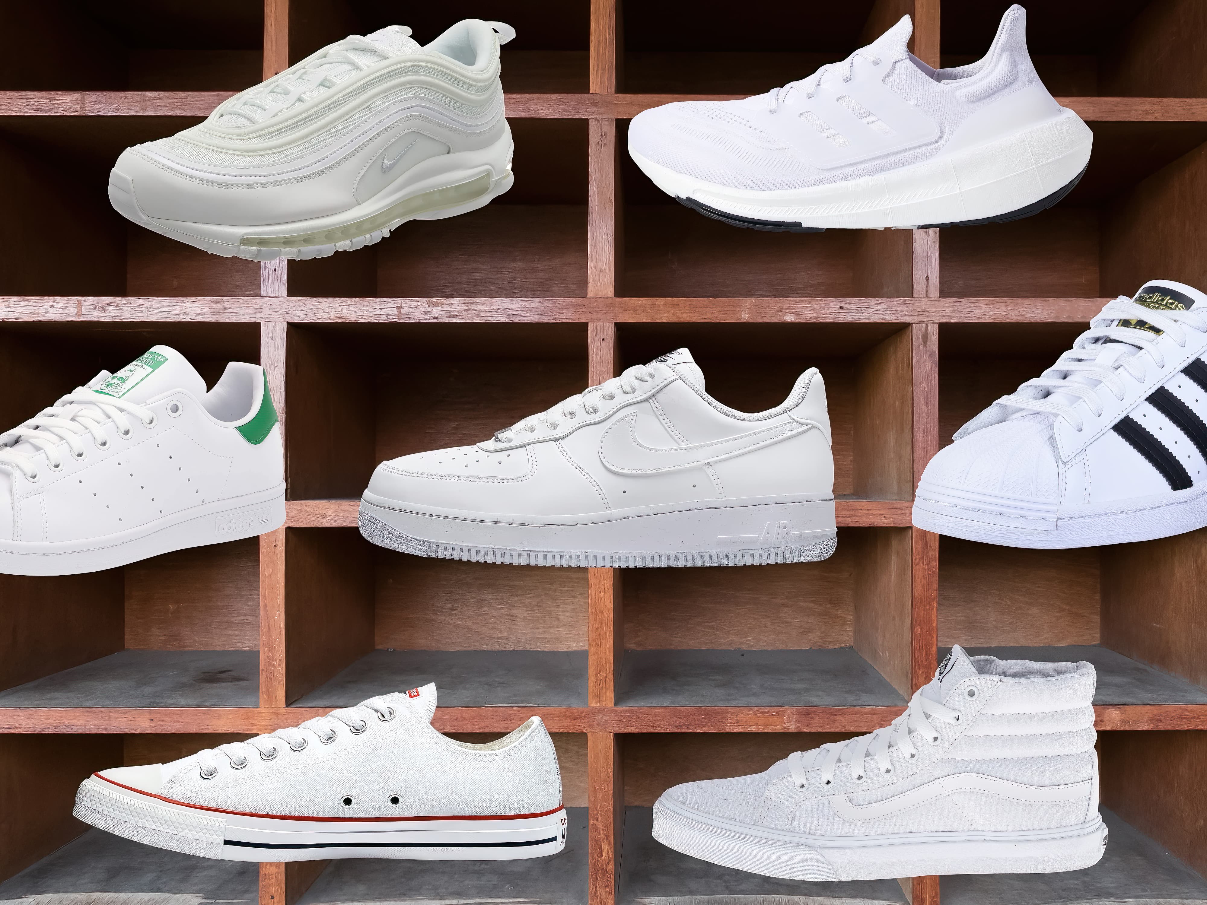 A shelf of women's white sneakers